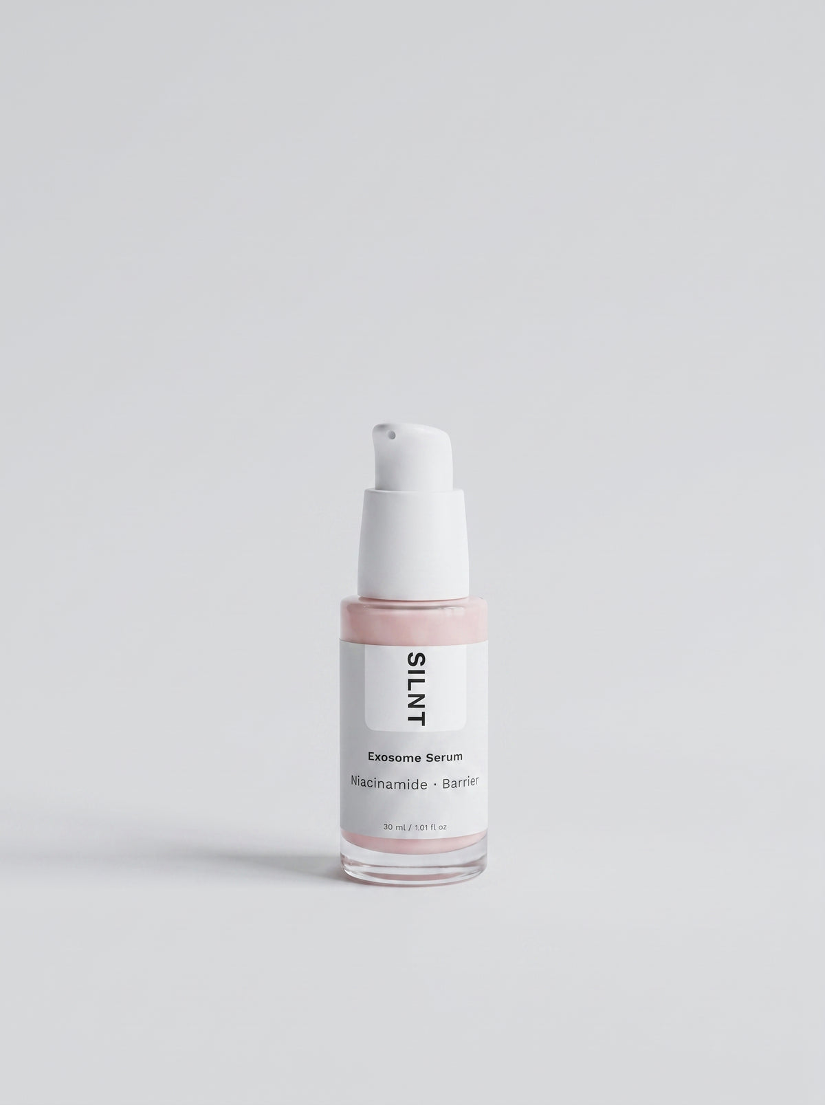 SILNT Exosome & Niacinamide Serum pump bottle with pink-tinted liquid on a light background