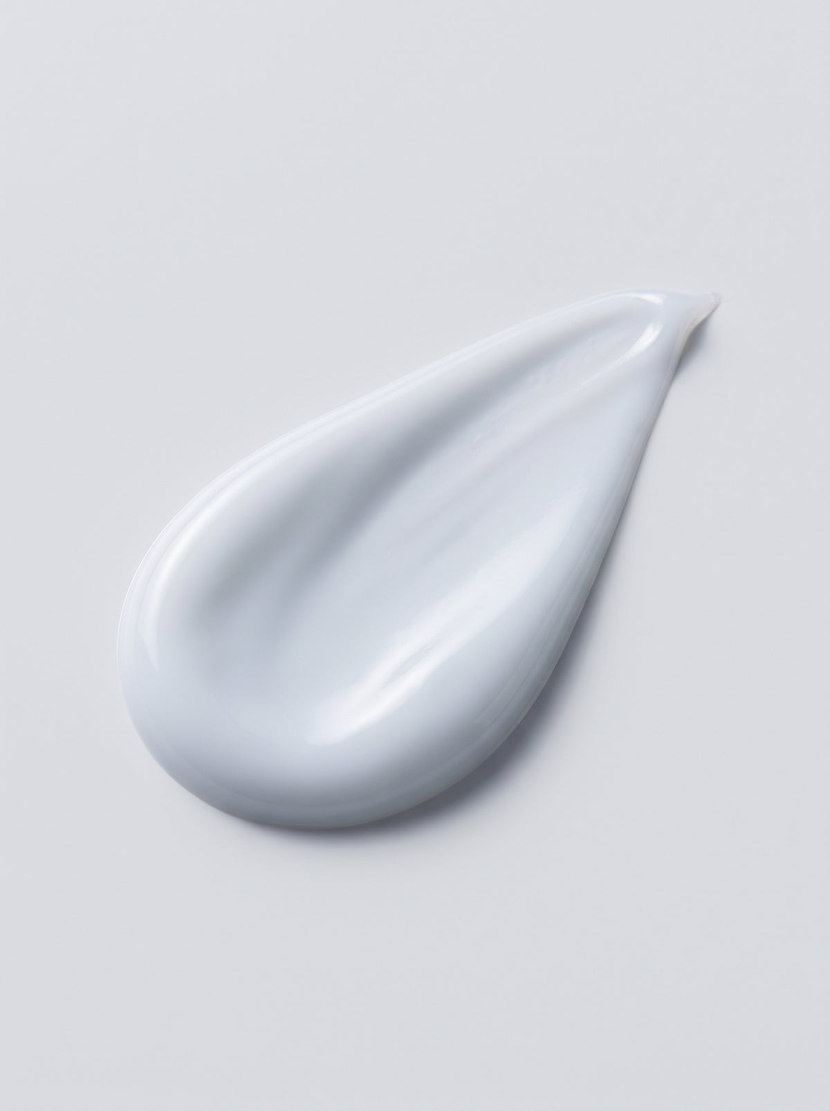 SILNT Cleansing Milk white swatch with a creamy finish on a light grey background