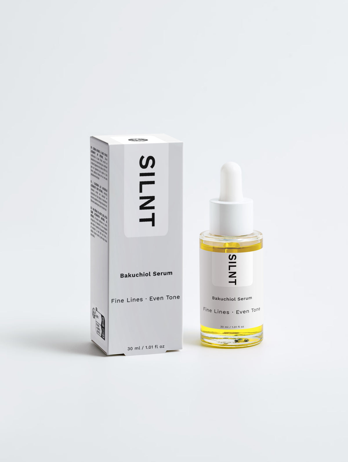 SILNT Bakuchiol Serum bottle standing beside its carton on a light grey background