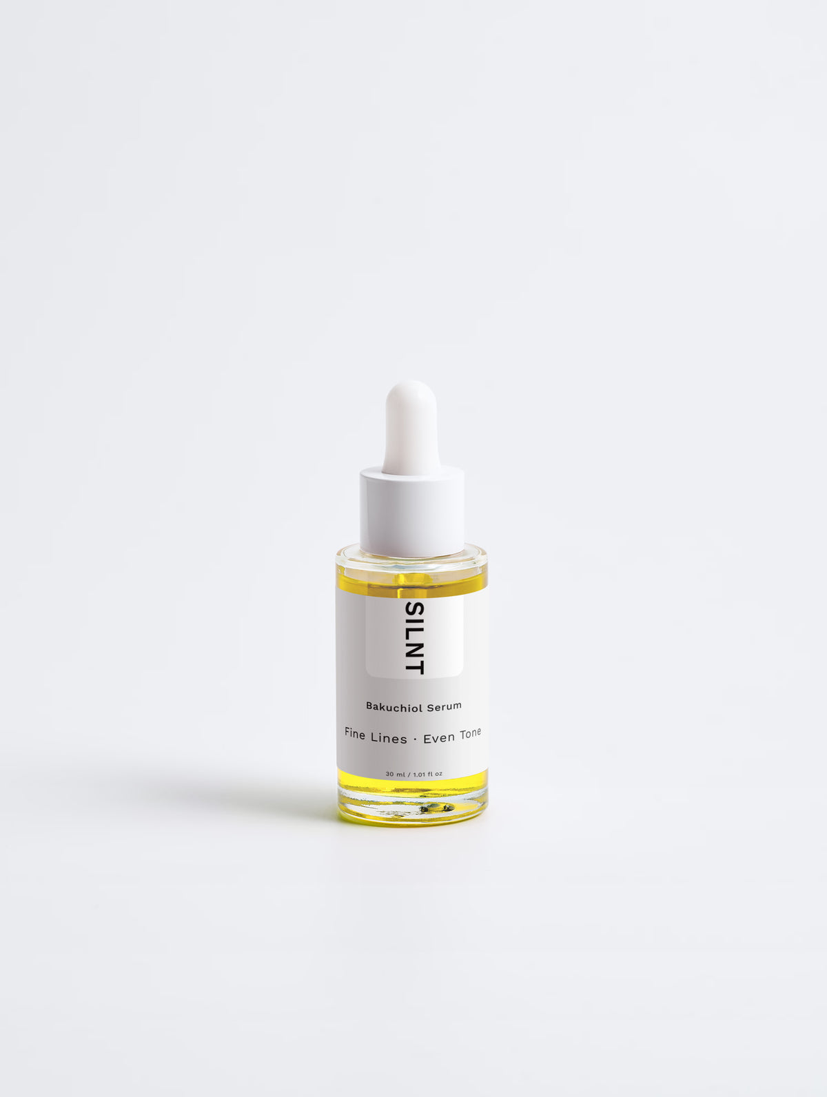 SILNT Bakuchiol Serum glass dropper bottle with golden oil on a light grey background