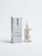 SILNT Exfoliating Concentrate dropper bottle beside its carton