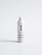 SILNT Hydrating Serum white pump bottle on a light grey background