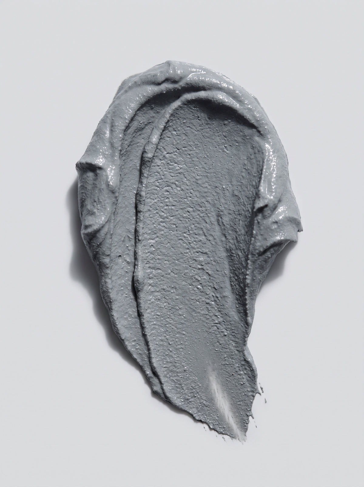 SILNT Clarifying Mask grey clay swatch with a matte finish on a light grey background