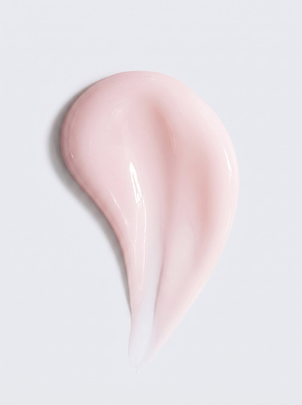Pale pink serum swatch of SILNT Exosome & Niacinamide Serum showing its smooth texture