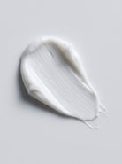 SILNT Eye Cream white cream swatch with a satin finish on a light grey background
