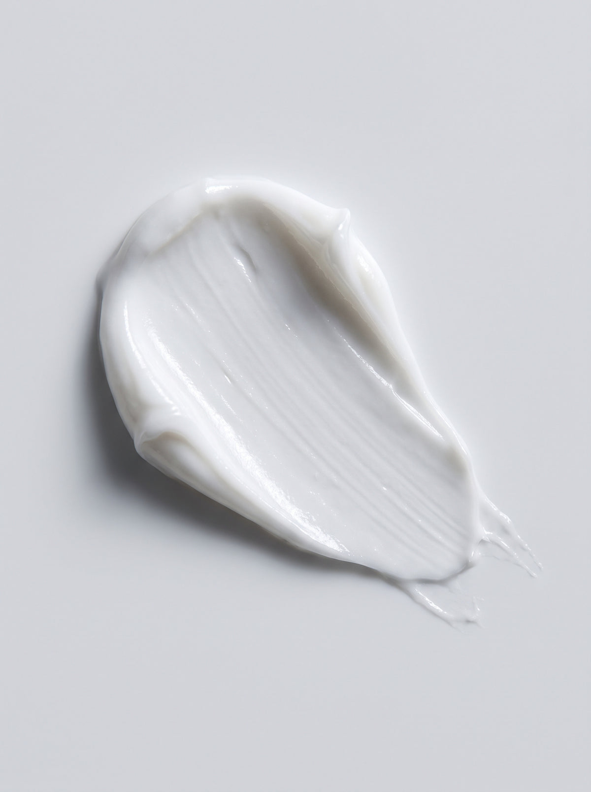 SILNT Eye Cream white cream swatch with a satin finish on a light grey background