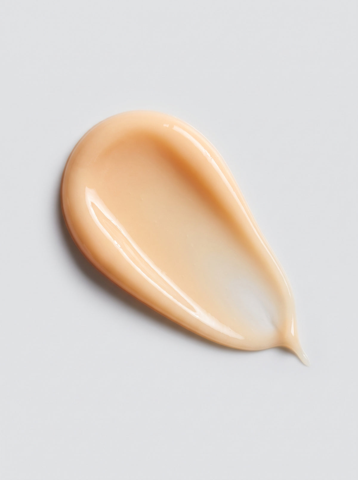 Golden-beige cream swatch of SILNT Brightening Cream showing its smooth texture