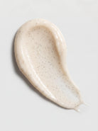 Creamy textured swatch of SILNT Brightening Polish showing fine polishing particles
