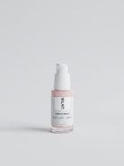 SILNT Exosome & Niacinamide Serum pump bottle with pink-tinted liquid on a light background