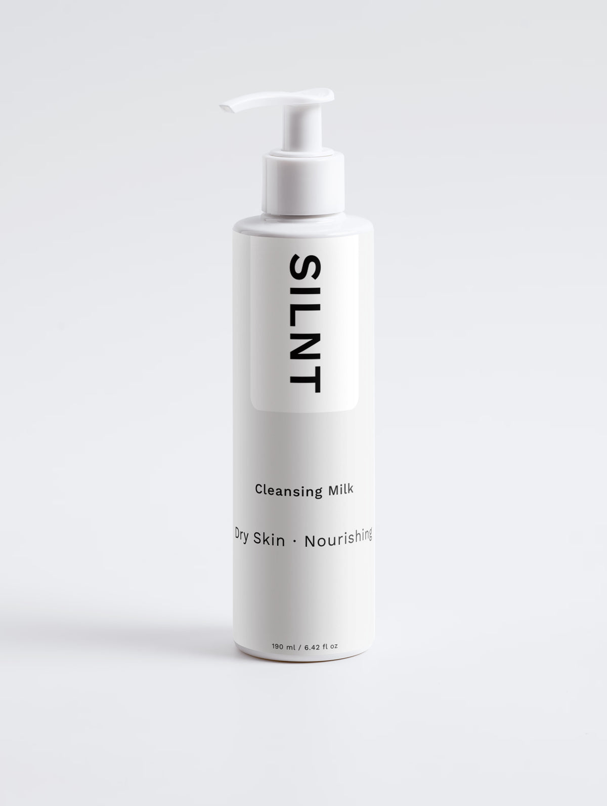 SILNT Cleansing Milk tall white pump bottle on a light grey background