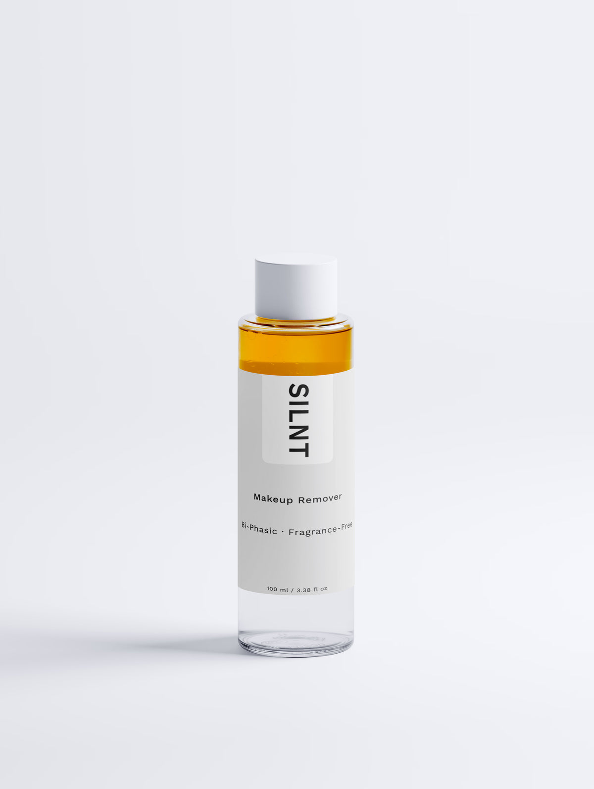 SILNT Makeup Remover bottle with golden bi-phasic liquid on a light grey background