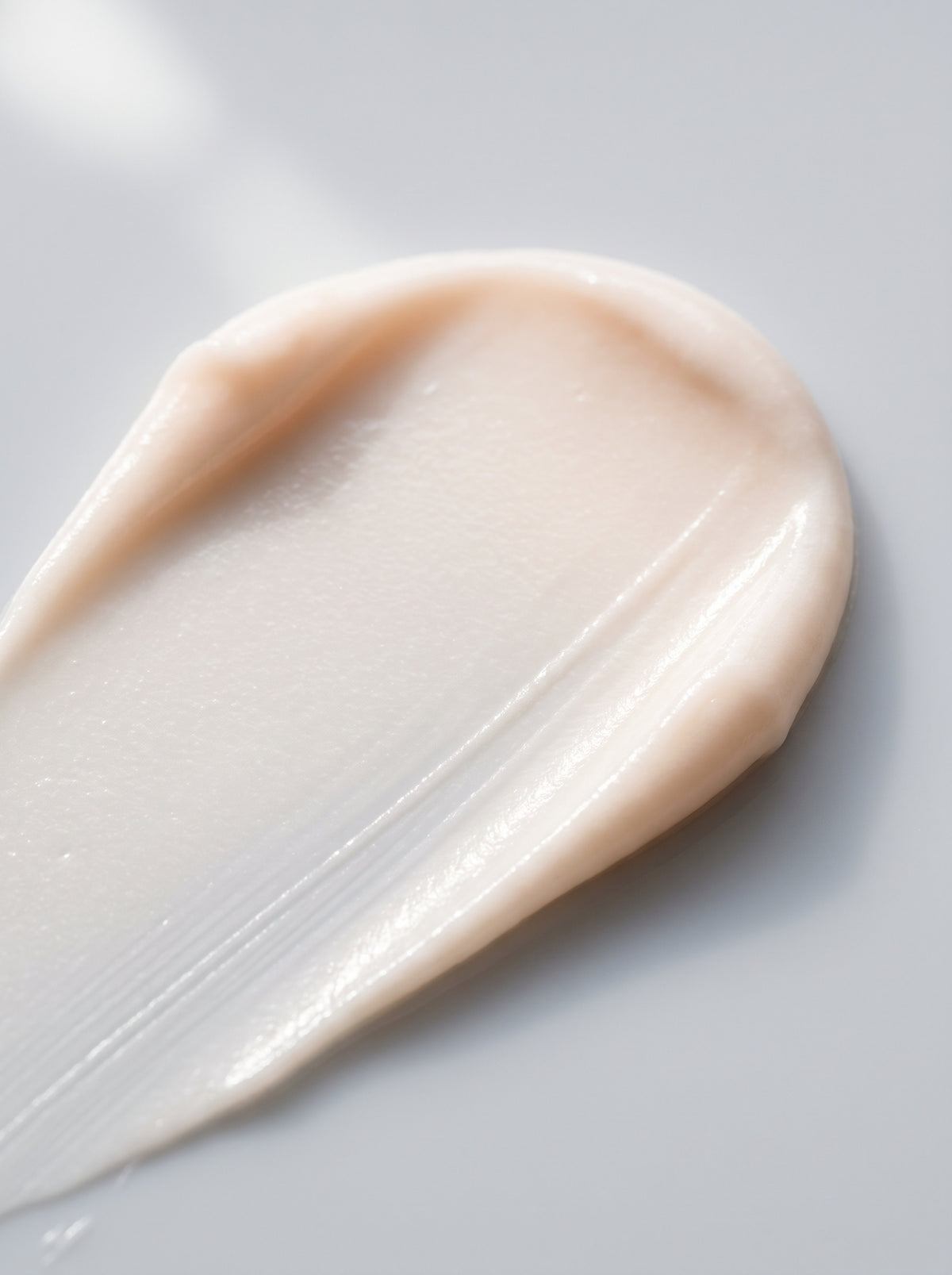 SILNT Day Cream ivory swatch with a matte-satin finish on a light grey background