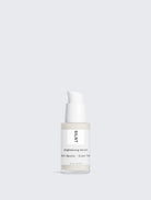 SILNT Brightening Serum frosted glass bottle with a white pump on a light grey background