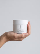 SILNT Clarifying Mask jar held upright in one hand, showing its 90 ml size, light grey background