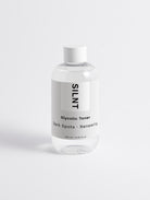 SILNT Glycolic Toner bottle standing on a light minimalist background