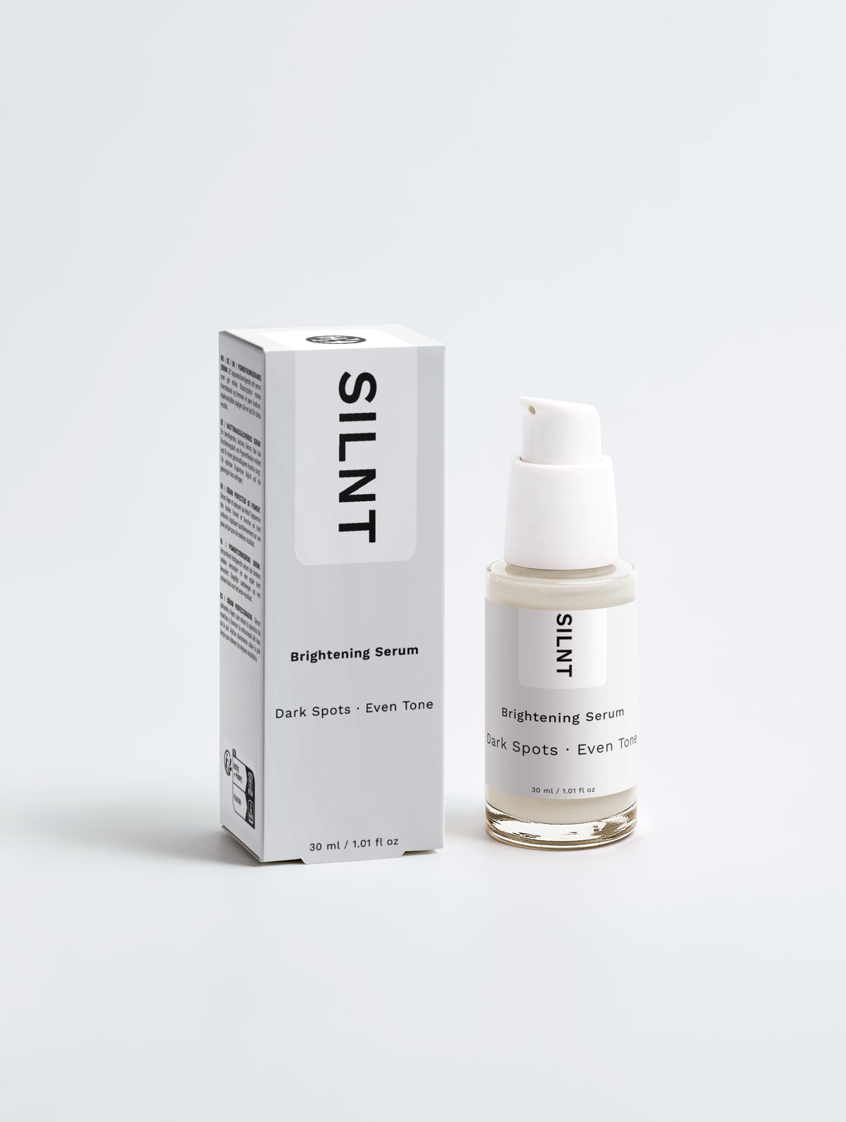 SILNT Brightening Serum bottle beside its carton on a light grey background