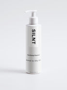 SILNT Clarifying Cleanser tall white pump bottle on a light grey background