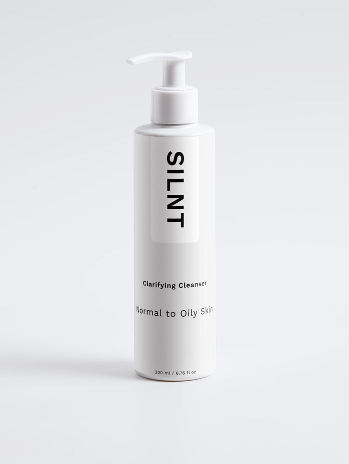 SILNT Clarifying Cleanser tall white pump bottle on a light grey background