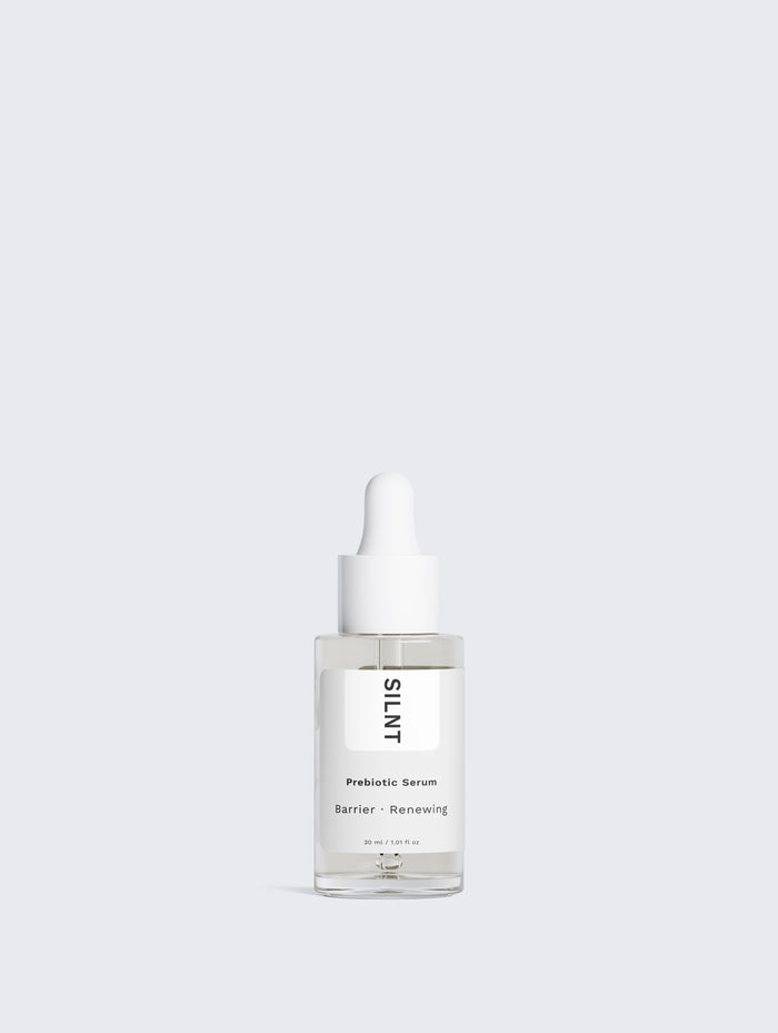 SILNT Prebiotic Serum glass dropper bottle standing on a light minimalist background