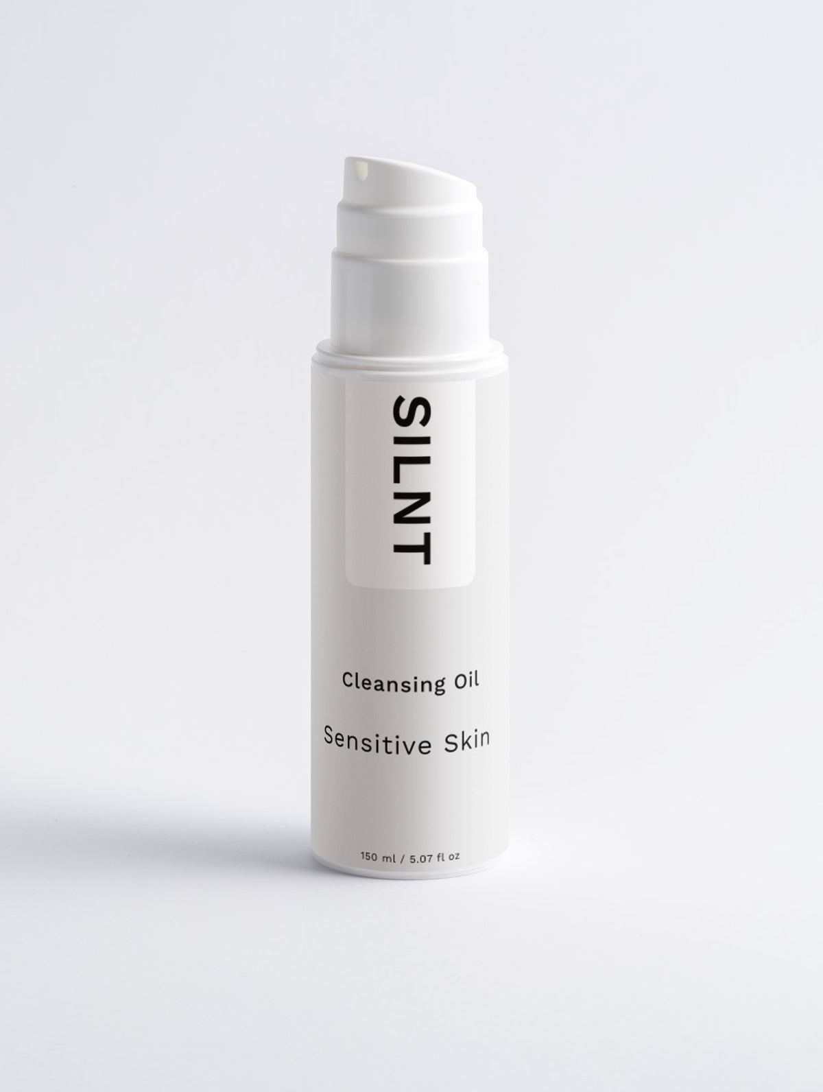 SILNT Cleansing Oil tall white pump bottle on a light grey background