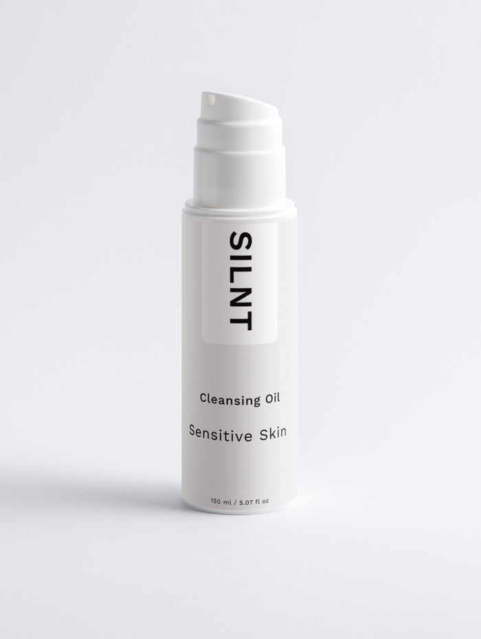 SILNT Cleansing Oil tall white pump bottle on a light grey background
